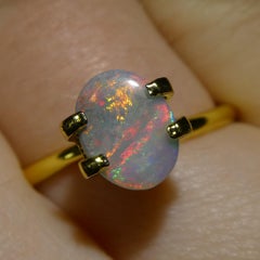 0.54ct Opale grigio ovale cabochon dall'Australia