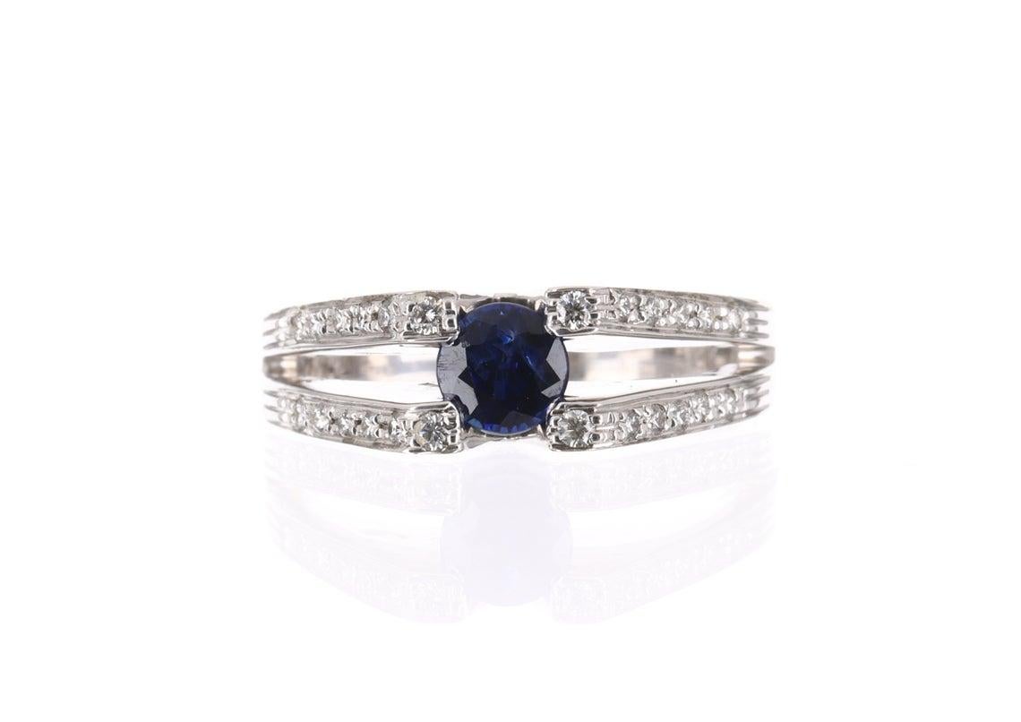 Displayed is a gorgeous contemporary tanzanite and diamond ring! This is quite an alluring piece with a stunning center stone! The center stone is securely prong set and is a natural tanzanite that weighs 1/3cts. The gemstone has a gorgeous fine