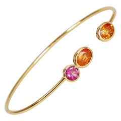 0.55 & 2.00 Carat Pink Tourmaline & Orange Sapphire 18k Yellow Gold Open Bangle