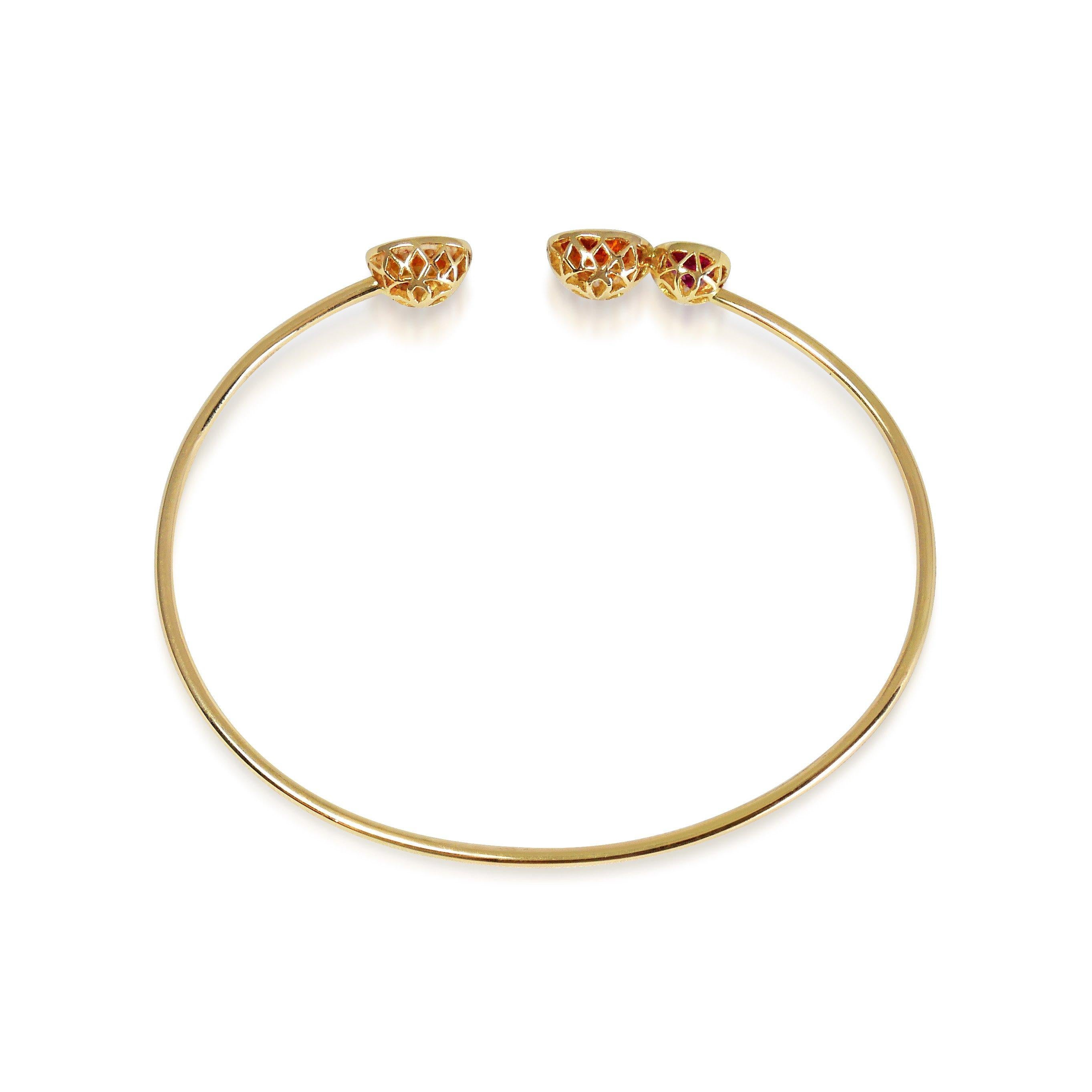 Handcrafted 0,55 Carat Pink Tourmaline & 2,00 Carat Orange Sapphires 18 Karat Yellow Gold Open Bangle Bracelet. Designed as birds singing next to one another this bracelet combines a colorful range of precious gems. Our signature hand pierced lace
