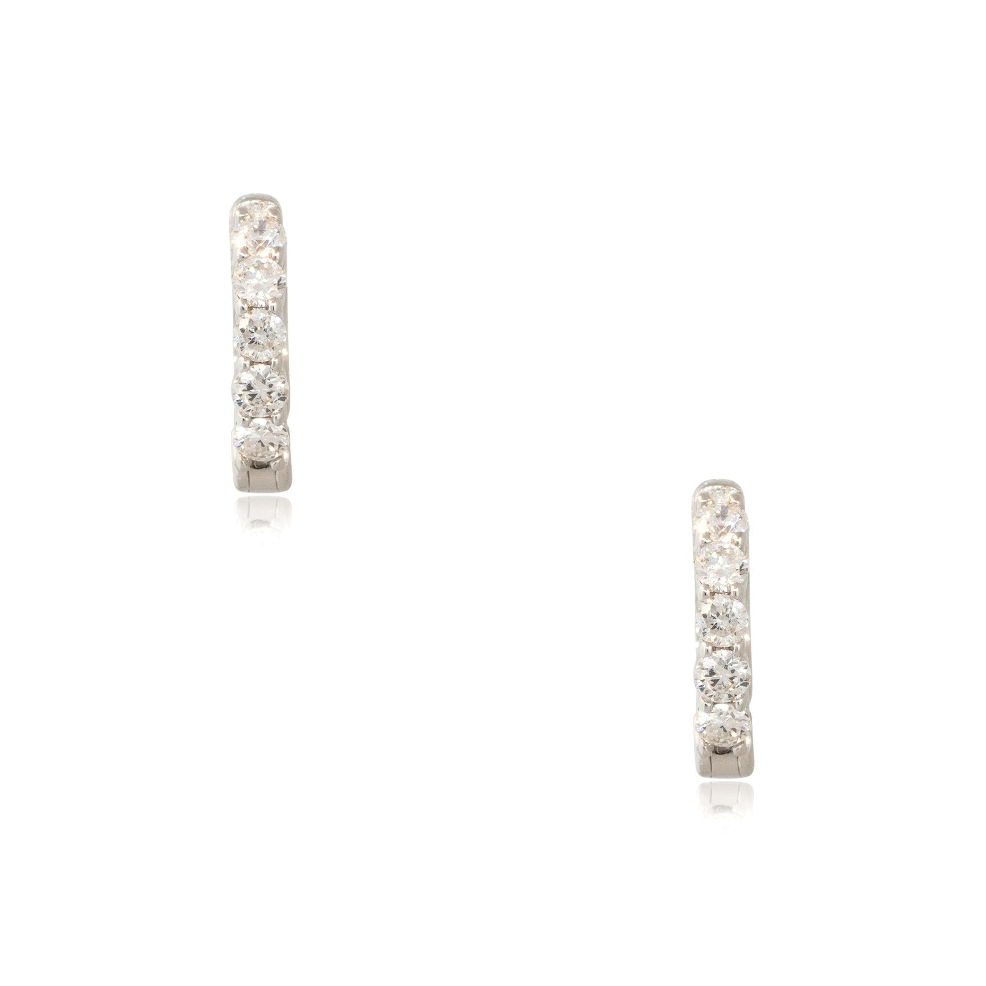 14k White Gold 0.55ctw 5 Diamond Tiny Huggie Hoop Earrings

Style: Tiny Diamond Huggie Earrings
Material: 14k White Gold
Diamond Details: Approximately 0.55ctw of Round Brilliant Cut Diamonds. There are 5 Diamonds in each earring, 10 Diamonds total.