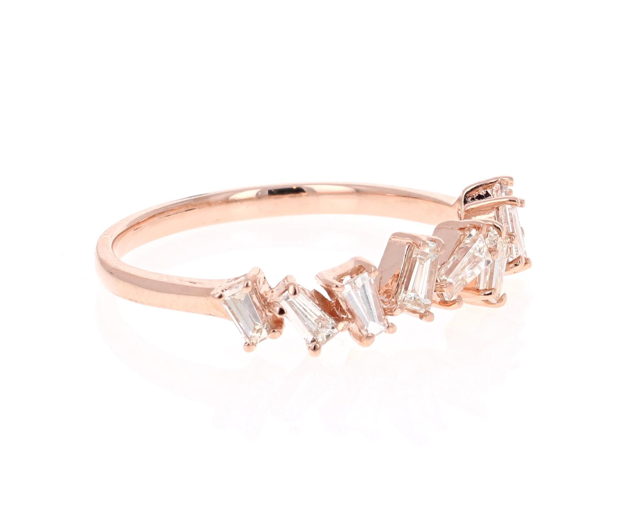 Unique and cute band that can be worn as a single band or stack with other bands in other colors of Gold! 

This ring has 12 Baguette Cut Diamonds that weigh 0.55 Carats. The clarity and color of the diamonds is VS-H.

Crafted in 14 Karat Rose Gold