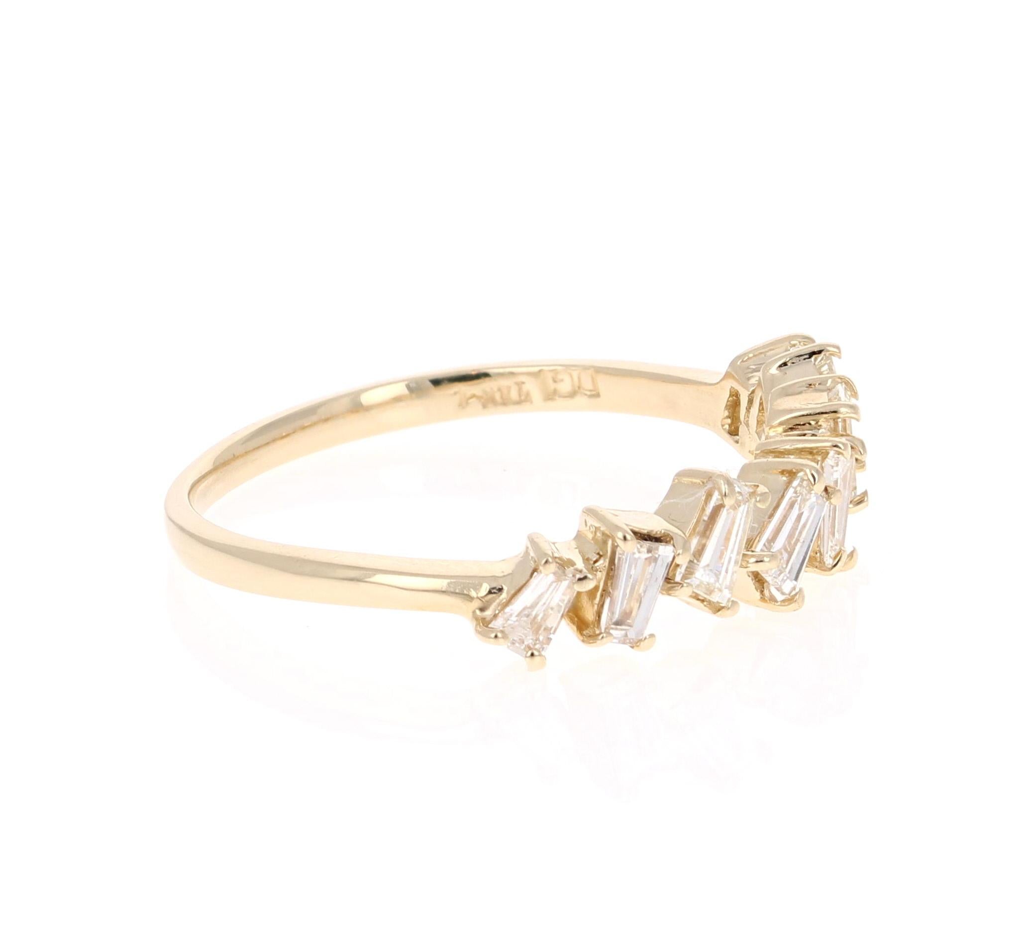 Unique and cute band that can be worn as a single band or stack with other bands in other colors of Gold! 

This ring has 12 Baguette Cut Diamonds that weigh 0.55 Carats. 

Crafted in 14 Karat Yellow Gold is 2.0 grams 

The ring is a size 7 and can