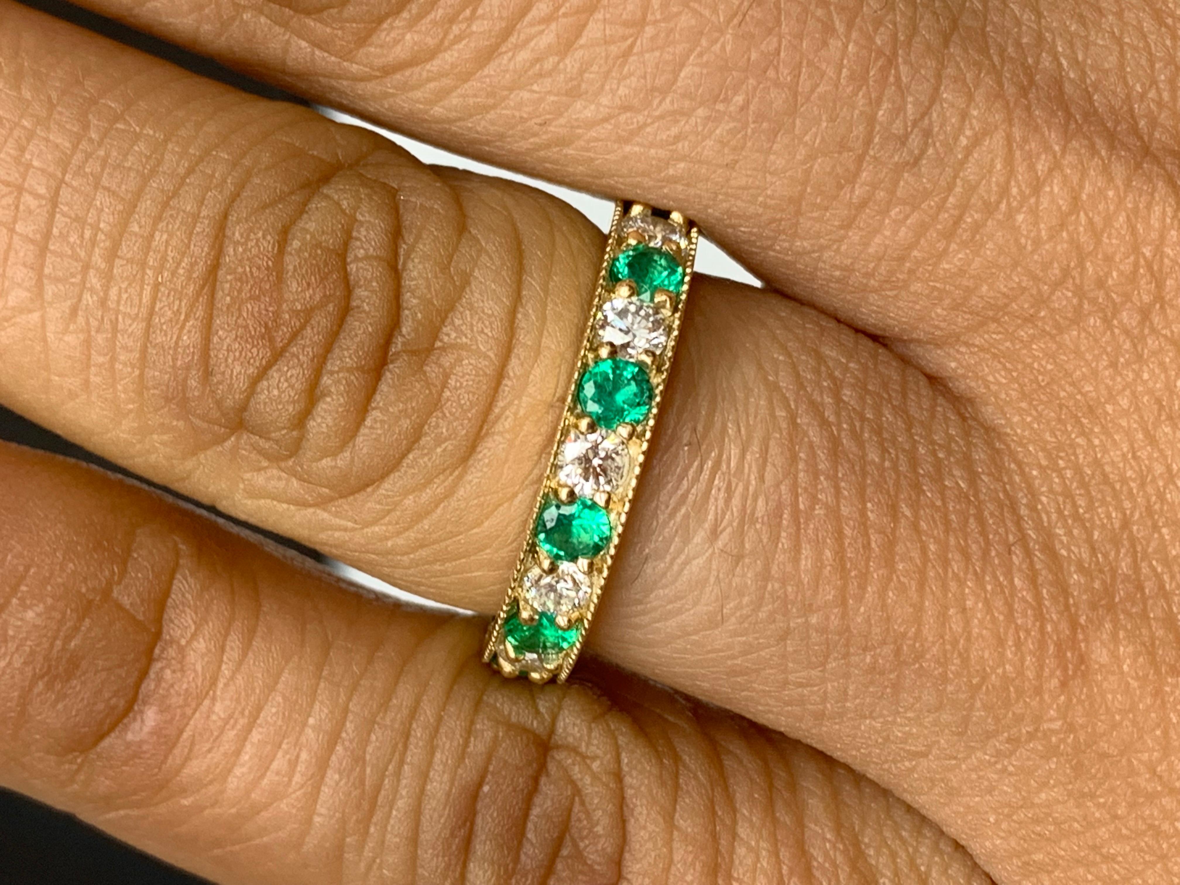 Handcrafted to perfection; showcasing color-rich brilliant-cut emeralds that elegantly alternate brilliant-cut diamonds in an 14k yellow gold setting. 
The 6 Emeralds weigh 0.55 carats total and 5 diamonds weigh 0.50 carats total.

Size 6.5 US