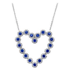 0.55 Carat Diamond and 0.79 Carat Blue Sapphire 14 Karat Gold Heart Necklace
