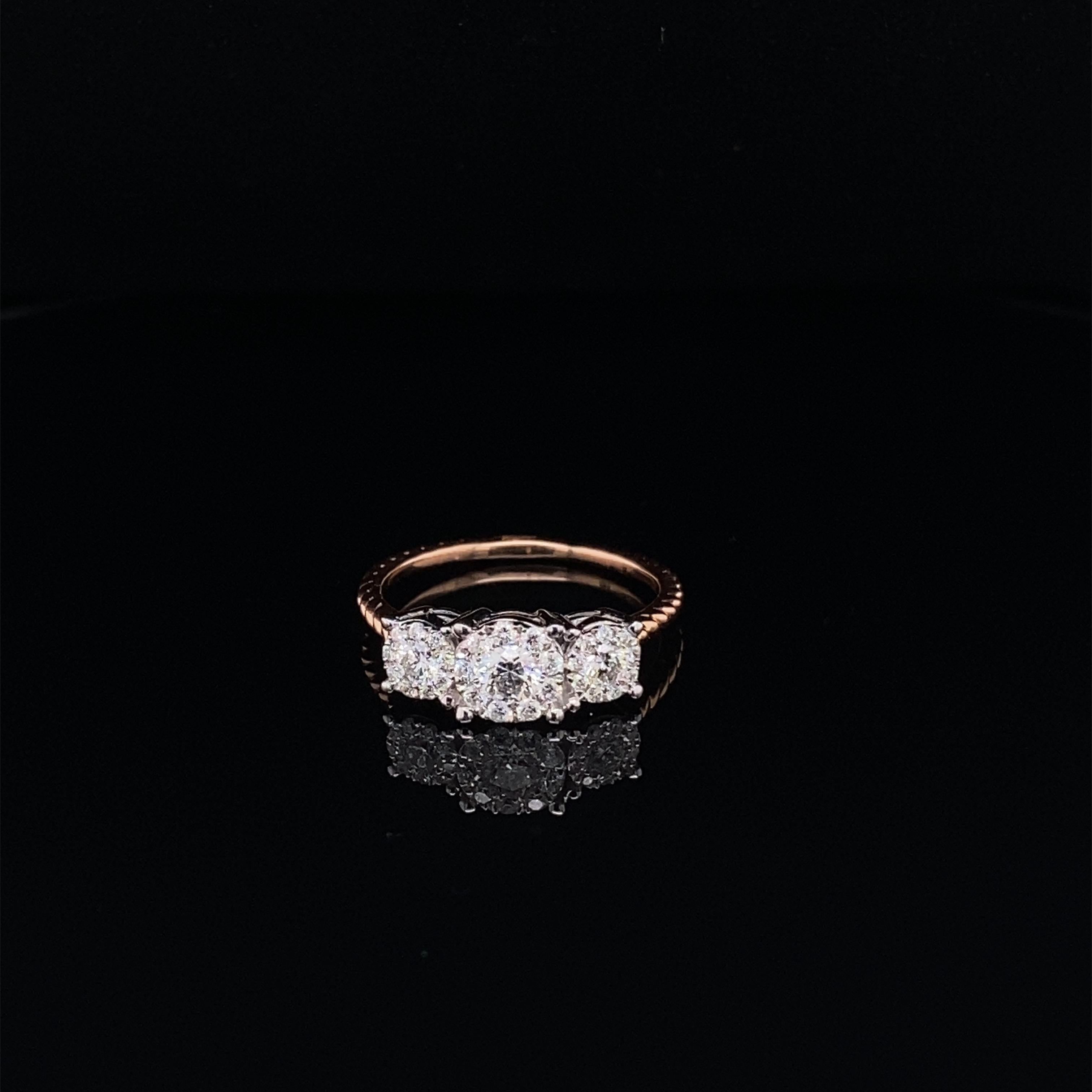 This stunning ring features 3 radiant Round Clusters of White Diamonds comprising of Round Diamonds.
This ring is set in 14K Rose Gold, with a 14K White Gold setting for the stones.
Total Diamond Weight = 0.55 Carats. Ring Size is 6 1/2.