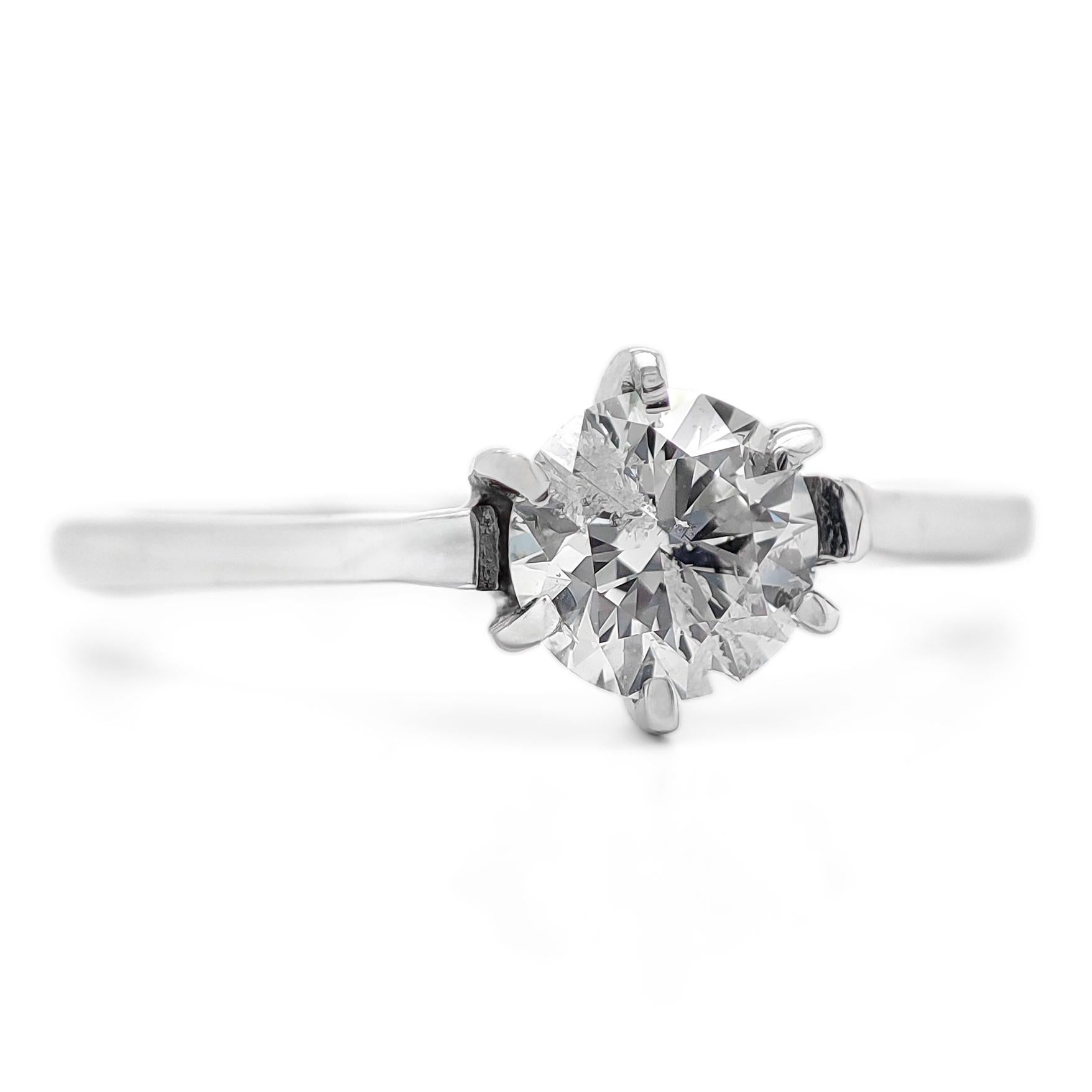 FOR US BUYER NO VAT

This solitaire engagement ring is a timeless symbol of your love and commitment. It features a brilliant 0.55 carat round diamond as its centerpiece, radiating its captivating and enduring sparkle.

The ring is crafted in 14K