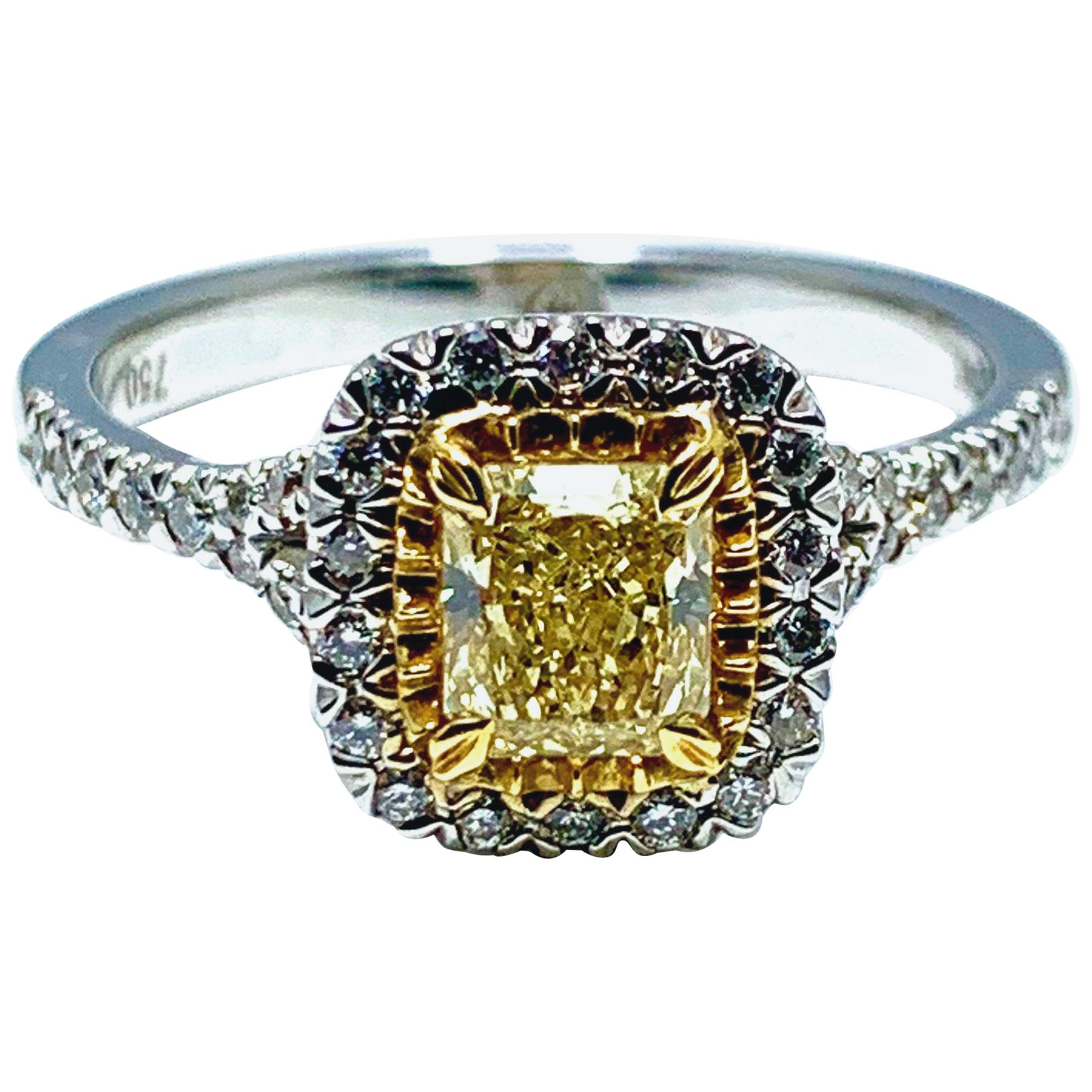 0.55 Carat Fancy Yellow Cushion Shaped Diamond and Platinum Engagement Ring