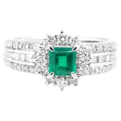 0.55 Carat Natural Emerald and Diamond Halo Ring Set in Platinum