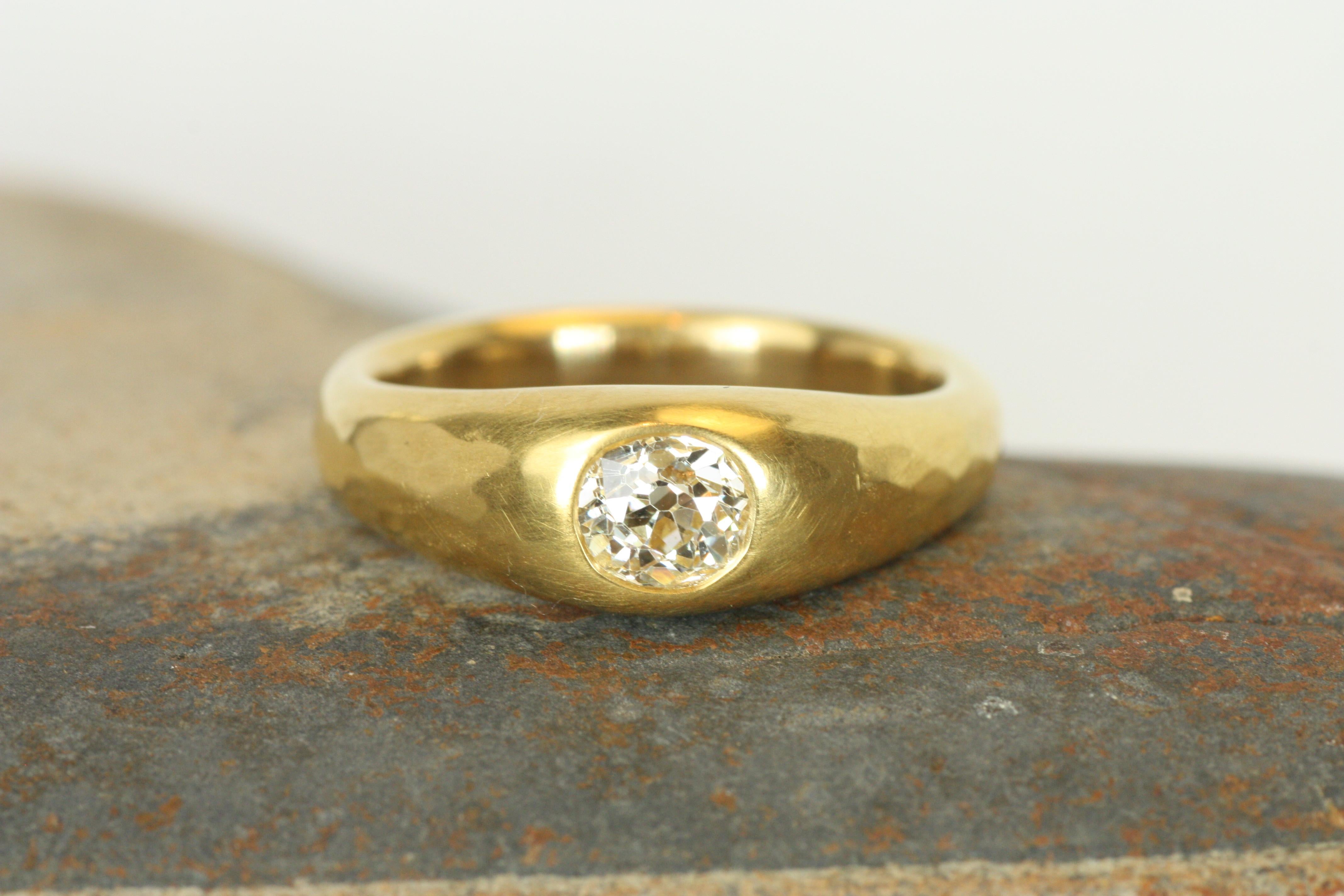 Embrace vintage elegance with this 0.55ct old mine cut diamond gypsy ring, set in luxurious 22K yellow gold with a soft, hammered finish. The old mine cut diamond sparkles with a charm reminiscent of a bygone era, creating a unique look with rich