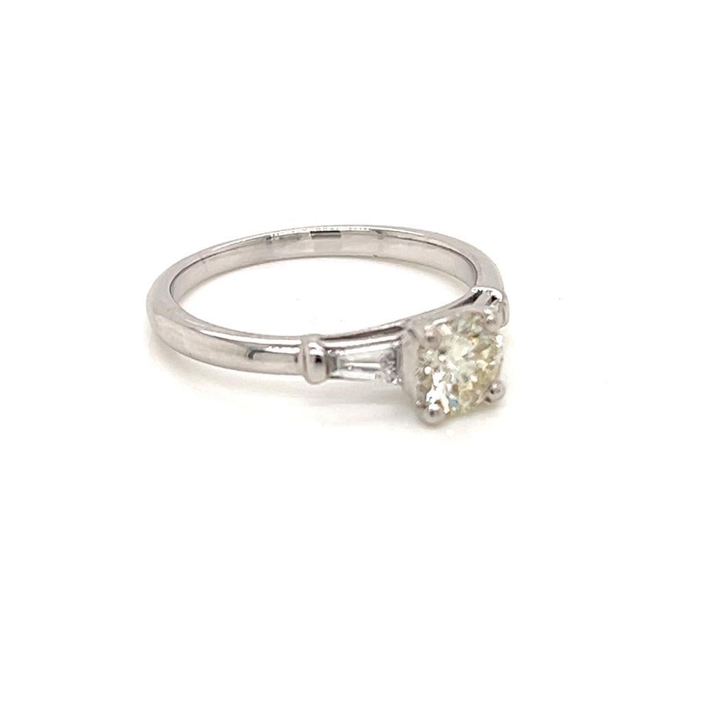 Contemporary 0.55 Carat Round Brilliant Diamond with Tapered Side Diamonds Platinum Ring For Sale
