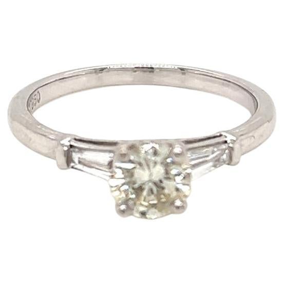 0.55 Carat Round Brilliant Diamond with Tapered Side Diamonds Platinum Ring For Sale