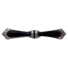 A 0.55 Carat Signed Art Deco Dreicer Platinum & Black Onyx Bow  Brooch 