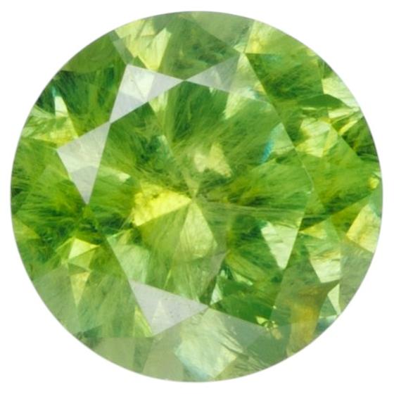 0.55 ct, Russian demantoid garnet with bissolite inclusions