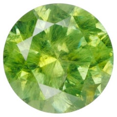 0.55 ct, Russian demantoid garnet with bissolite inclusions