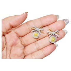 0.558 Carat Fancy Yellow Diamond Earrings SI1 Clarity AGL Certified
