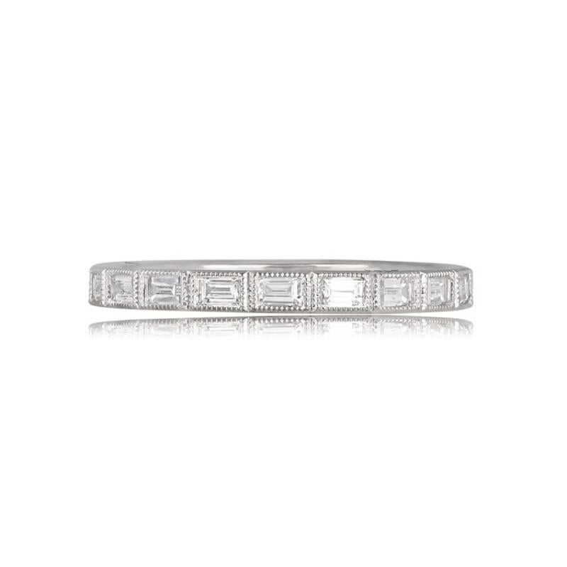 This platinum wedding band exudes elegance with its bezel-set baguette-cut diamonds, creating a stunning eternity setting. The total diamond weight of the band is 0.55 carats, providing a touch of sparkle. With a width of 2.20mm, the band features