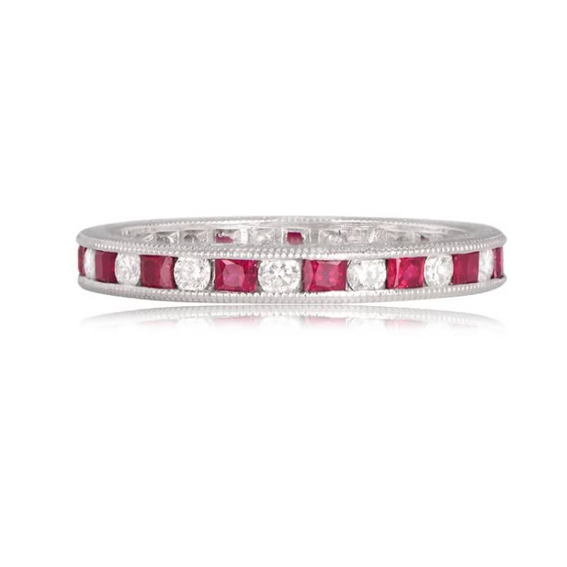 A stunning band featuring approximately 0.55 carats of round brilliant cut diamonds and 1.05 carats of French cut rubies. Crafted in platinum, the diamonds exhibit G/H color and VS1 – VS2 clarity, channel set with meticulous detail. The band