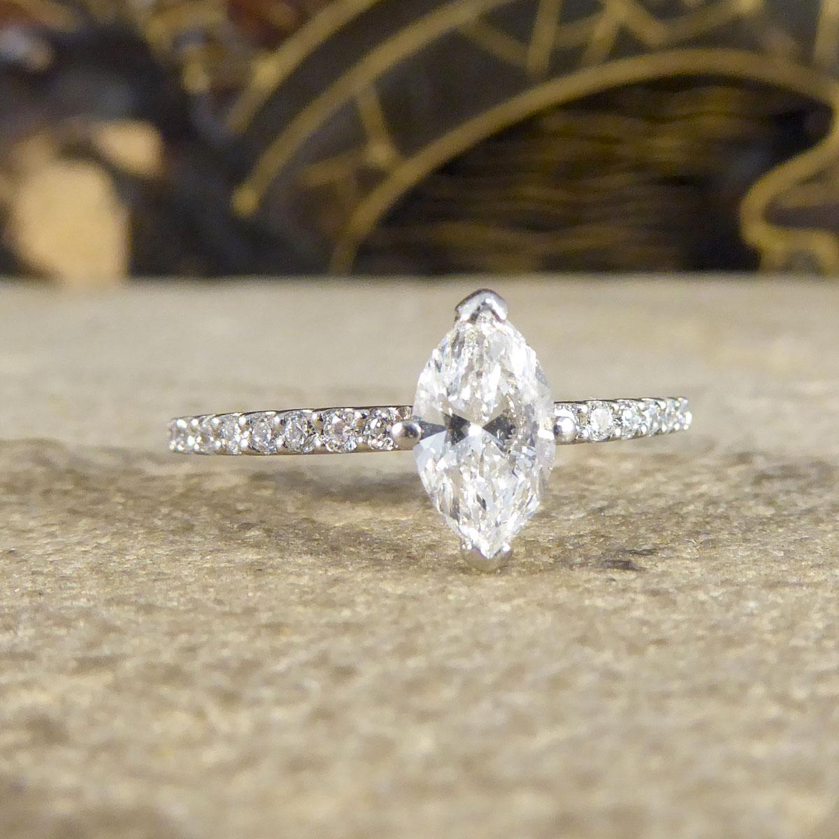 This beautifully sparkly engagement ring holds a very clear and bright Marquise Cut Diamond weighing 0.55ct in a four claw setting. The Marquise Diamond itself is very clear in a basket setting allowing a lot of light to pass through and sparkle
