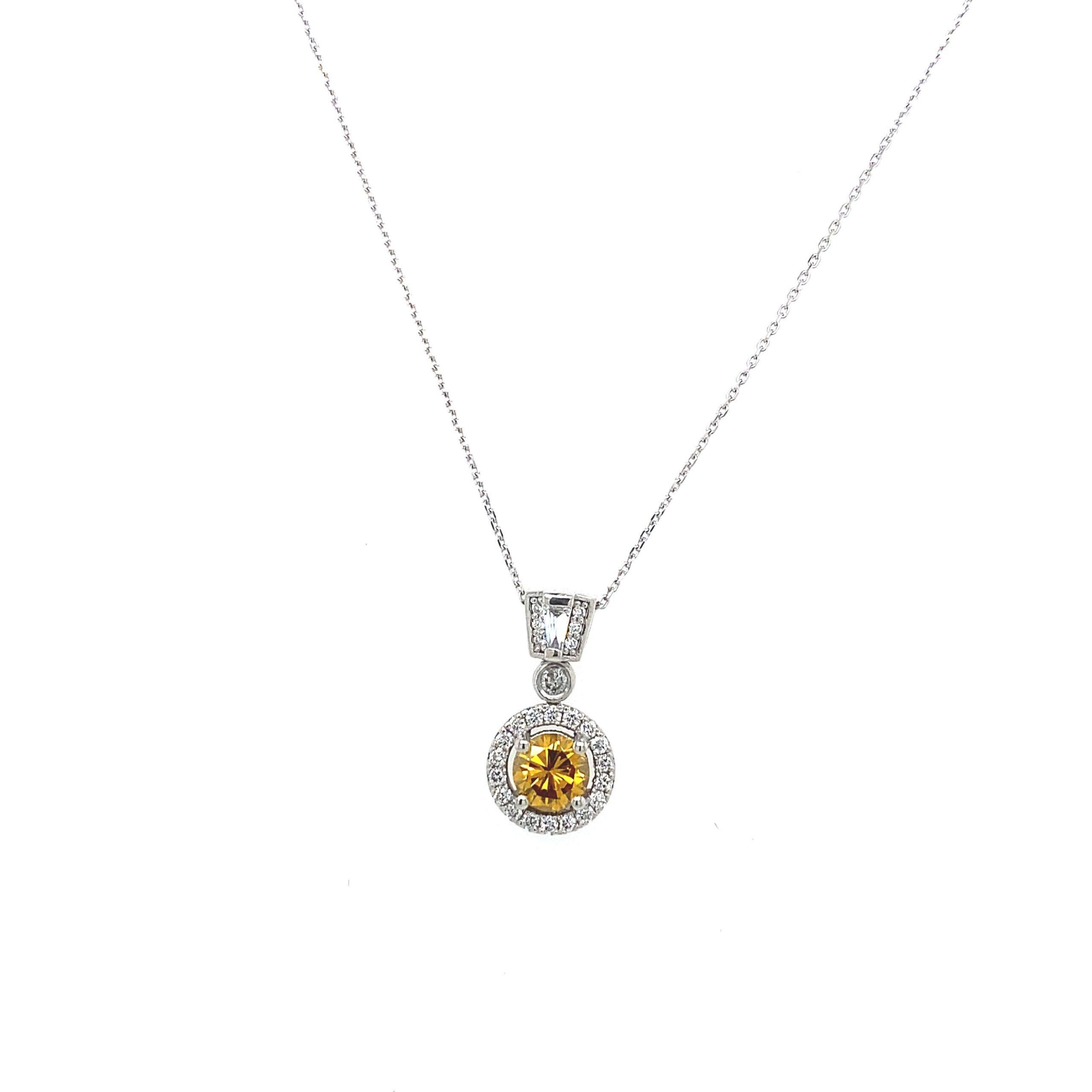 0.55ct Natural Orange Diamond and Platinum Pendant with White Diamonds TDW 1.0ct

Surrounded by 0.45ct of White Diamonds. Round Brilliant Cut Diamonds and One Tapered Baguette. Suspended on a Platinum Trace Chain with a Lobster Clasp.

Additional