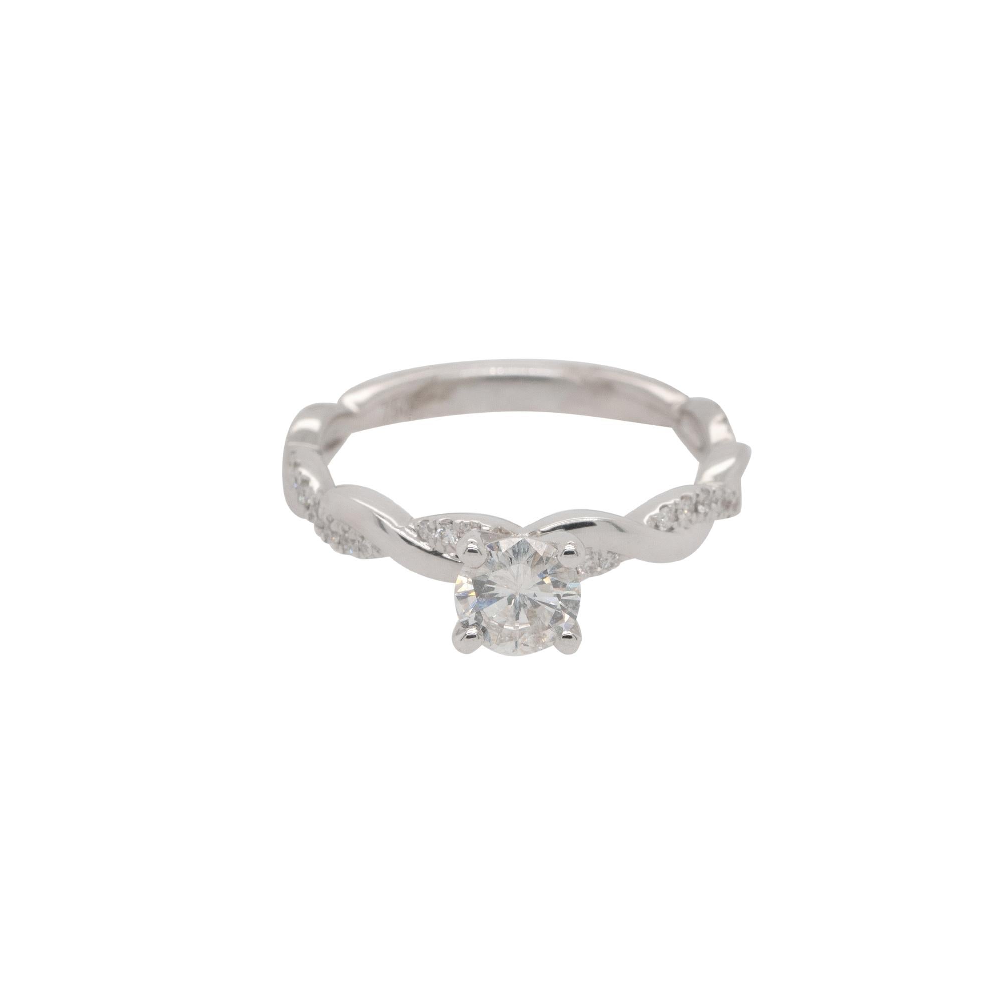Center Details: 0.55ct Round Brilliant Natural Diamond that is H in color and SI2 in clarity
Ring Material: 18k white gold
Ring Details: Center Diamond is set in a white gold twisted mounting featuring approximately 0.16ctw of round cut Diamonds.