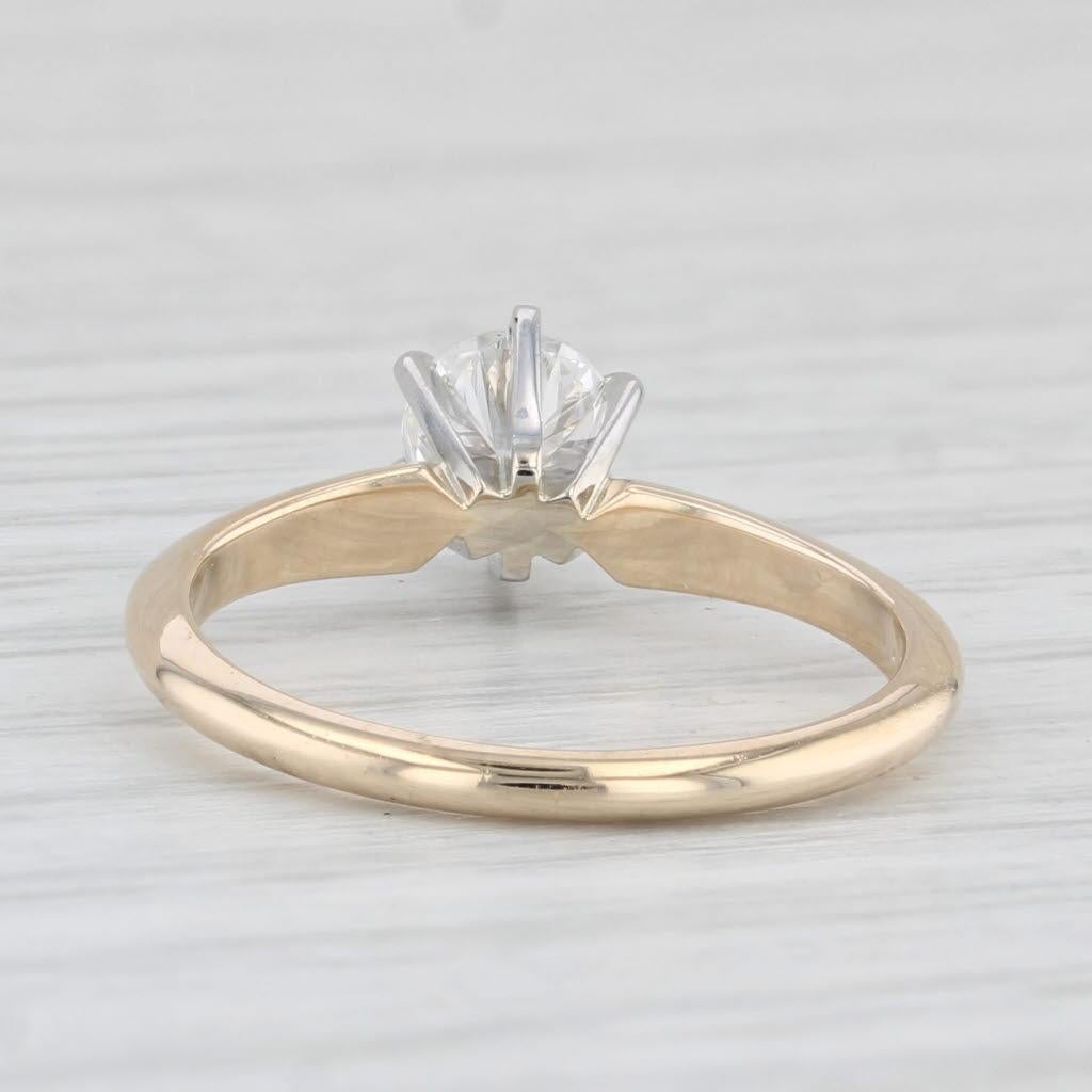 Gemstone Information:
- Natural Diamond -
Carats - 0.55ct 
Cut - Round Brilliant
Color - F - G
Clarity - VS1

Metal: 14k Yellow Gold, White Gold Prong Setting
Weight: 2.2 Grams 
Stamps: 14k
Face Height: 6.5 mm 
Rise Above Finger: 7.1 mm
Band / Shank