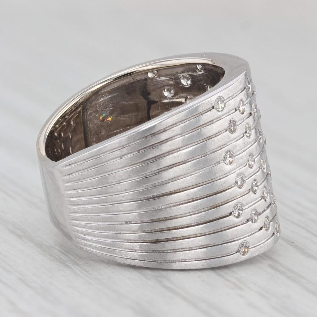 Gemstone Information:
- Natural Diamonds -
Total Carats - 0.55ctw
Cut - Round Brilliant
Color - G- H
Clarity - SI1 - SI2

Metal: 14k White Gold
Weight: 7.6 Grams 
Stamps: 14k
Face Height: 16 mm 
Rise Above Finger: 2.6 mm
Band / Shank Width: 6.4