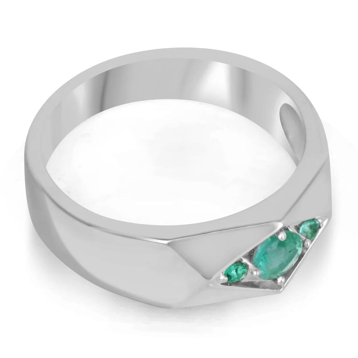 A dapper natural emerald men's ring that features three petite Asscher cut emeralds in the very center; creating a unique three-stone look that showcases vertically. Ideal for everyday use, and crafted in shiny sterling silver.

Setting Style: