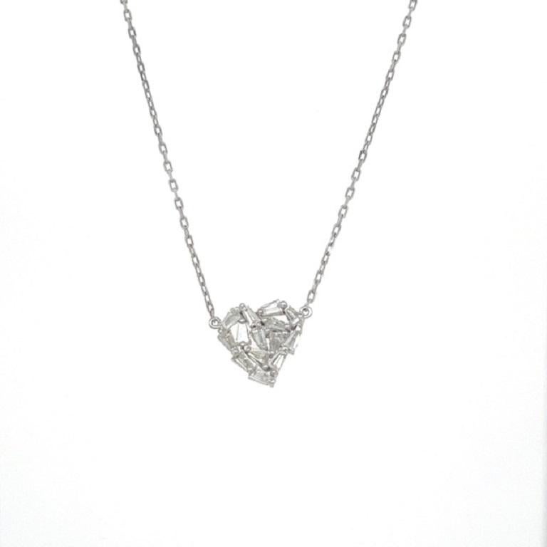 This heart shape pendant necklace has Natural Tapered Baguette Cut Diamonds that weigh 0.56 carats. The clarity and color of the necklace are VS-I.

The approximate weight of this necklace is 2.7 grams. 

The necklace is 18 inches long. 