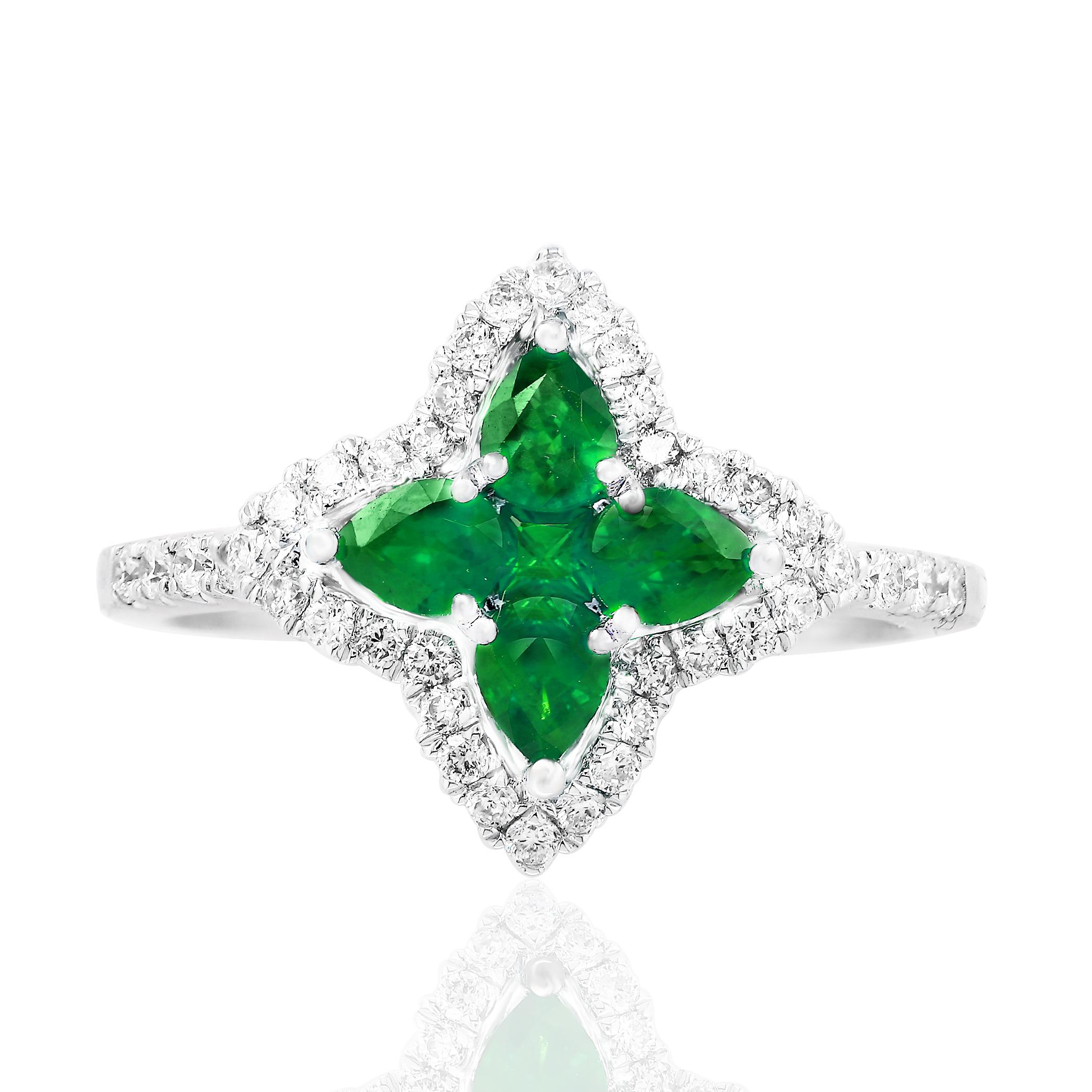 Showcasing flower design color-rich ring with 4 pear shape emerald weighing 0.56 carats total and 1 round shape emerald weighing 0.05 carat, accented by a row of round brilliant diamonds. Diamonds weigh 0.35 carats total. Set in a polished 18K white