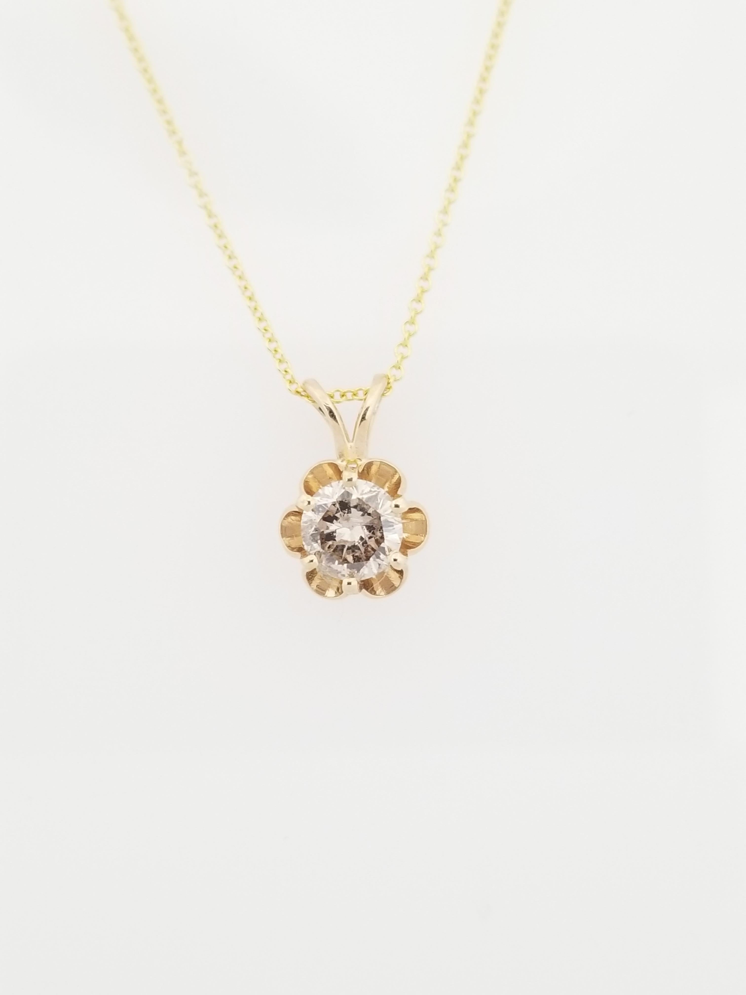 This gorgeous diamond pendant features a 0.56 carat round diamond solitaire set in a beautiful 14 karat yellow gold buttercup design. Pendant measures approximately 0.5 inch length and 0.25 inch wide. 

(Pendant Only - Chain sold separately)