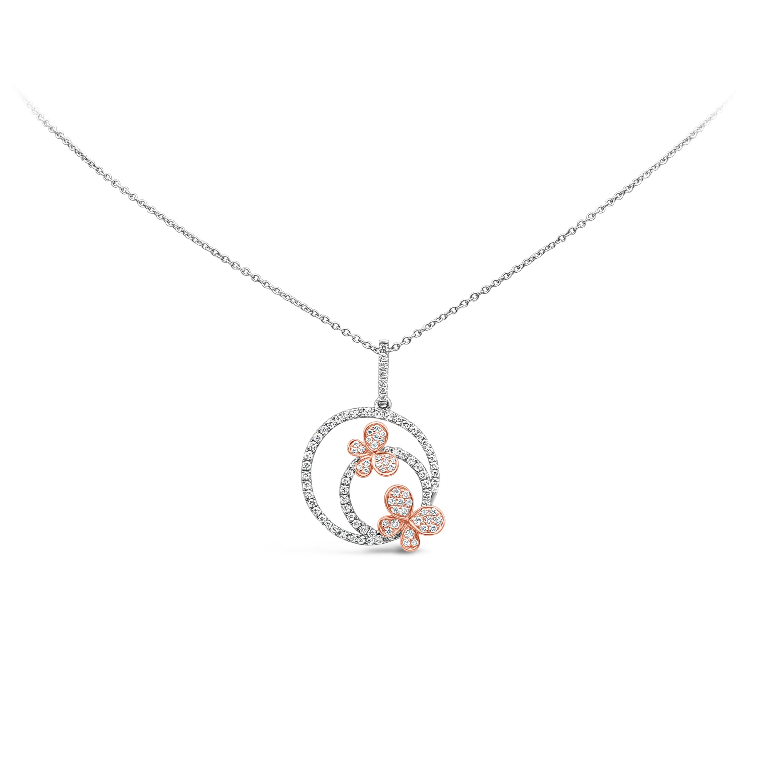 This unique and beautiful pendant necklace features open-work two concentric circles with two butterflies set, 111 pieces of round brilliant diamonds weighing 0.56 carat total, F-G Color and VS-SI in Clarity. Suspended on a diamond encrusted bail.