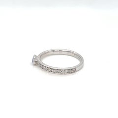 0.56 Carats Oval Sapphire Solitaire Bezel Ring with Diamonds