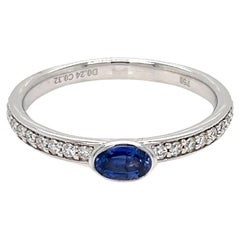 0.56 Carats Oval Sapphire Solitaire Bezel Ring with Diamonds