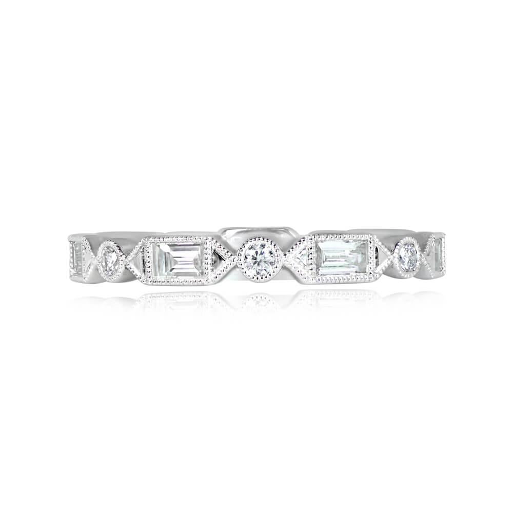 This stunning wedding band boasts a geometric design adorned with round brilliant and baguette cut diamonds, collectively weighing approximately 0.56 carats. Each diamond is elegantly set in bezels, enhancing the band's allure. Crafted in platinum,