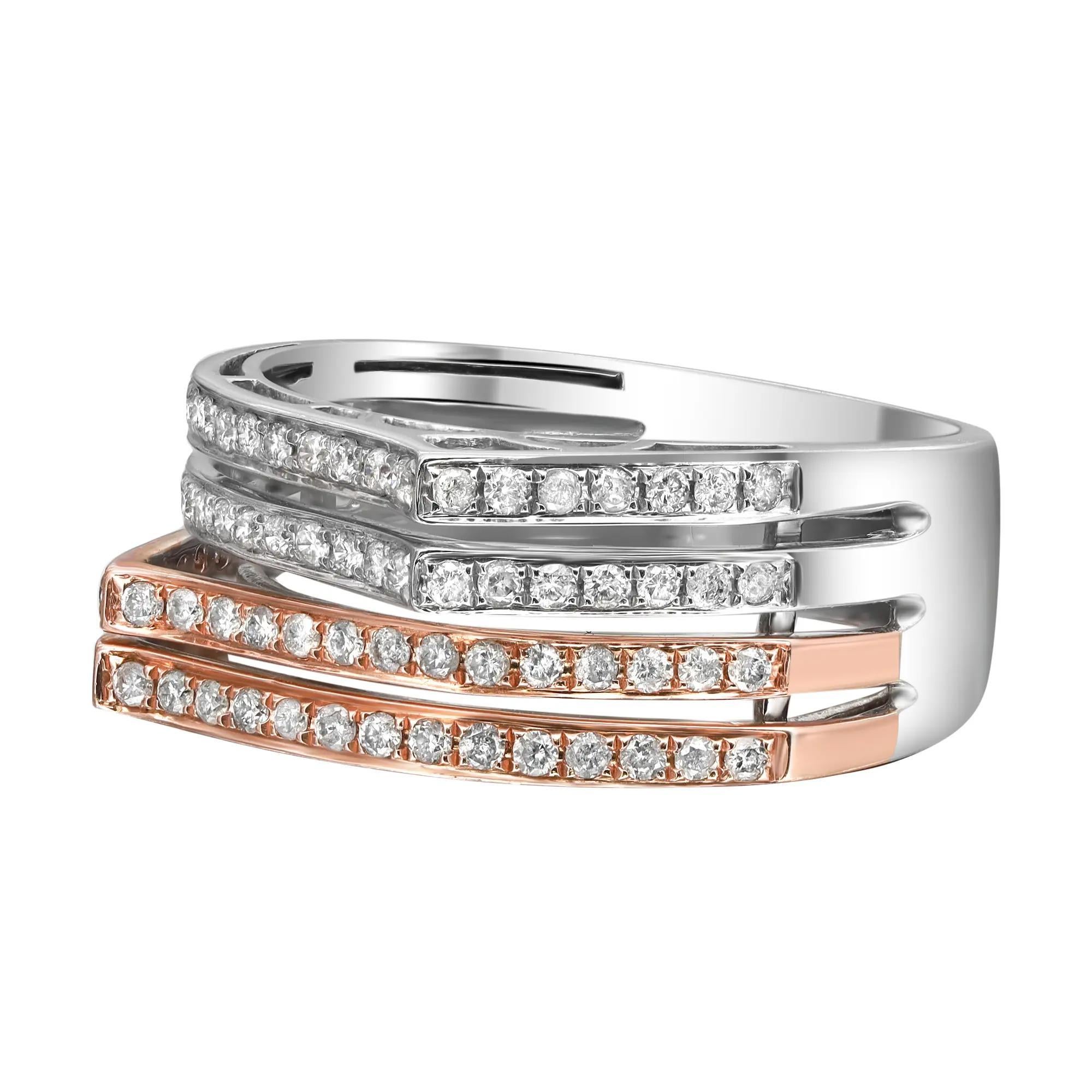 This elegant and classic two tone diamond band ring is crafted in 14k white and rose gold. Features four rows of pave set round brilliant cut diamonds weighing 0.56 carat. Ring width: 9mm. Ring size: 7.5. Total weight: 6.07 grams. Perfect addition