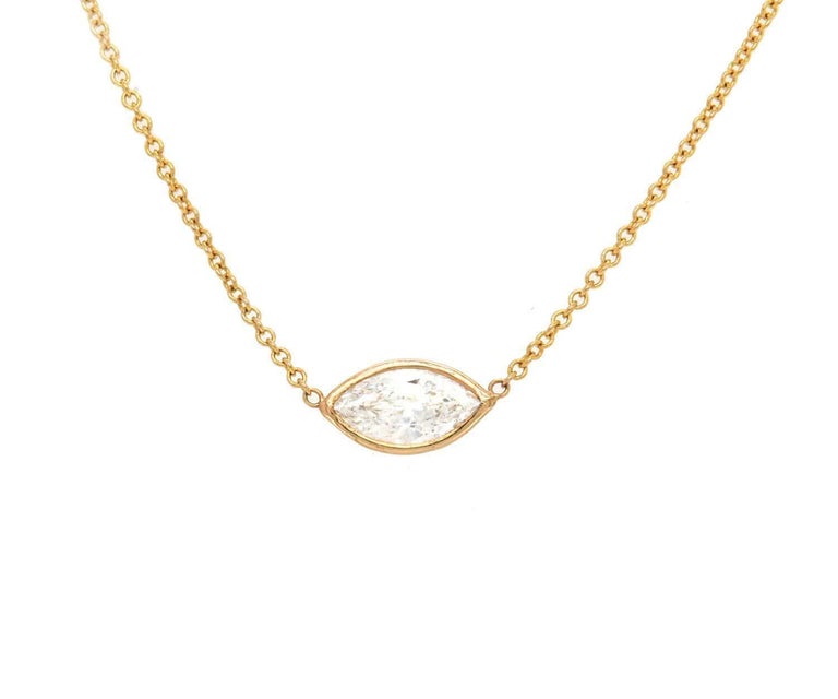0.56ctw Marquise Cut Diamond Solitaire Necklace 14K Gold

Marquise Cut Diamond Solitaire Pendant Necklace
14K Yellow Gold
Diamond Weight (Approx.): 0.56ct
Diamond Clarity: SI2
Diamond Color: G
Chain Length: 16.0 Inches
Pendant Size: 5.0mm x