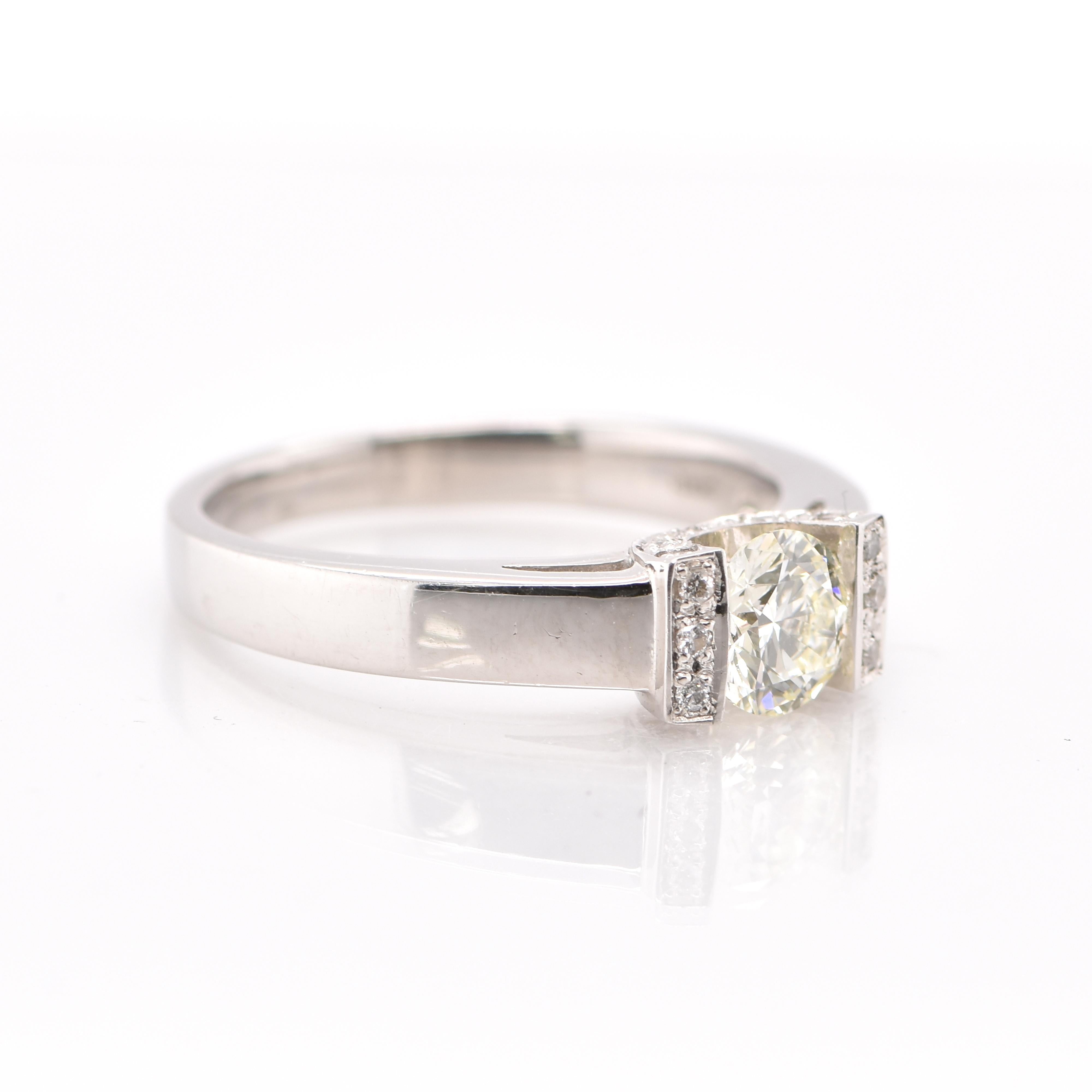 An gorgeous Engagement Ring featuring a 0.57 Carat, N VS-2 Solitaire Diamond and 0.08 Carats of accent Diamonds set in Platinum. Diamonds have been adorned and cherished throughout human history and date back to thousands of years. They are rated as