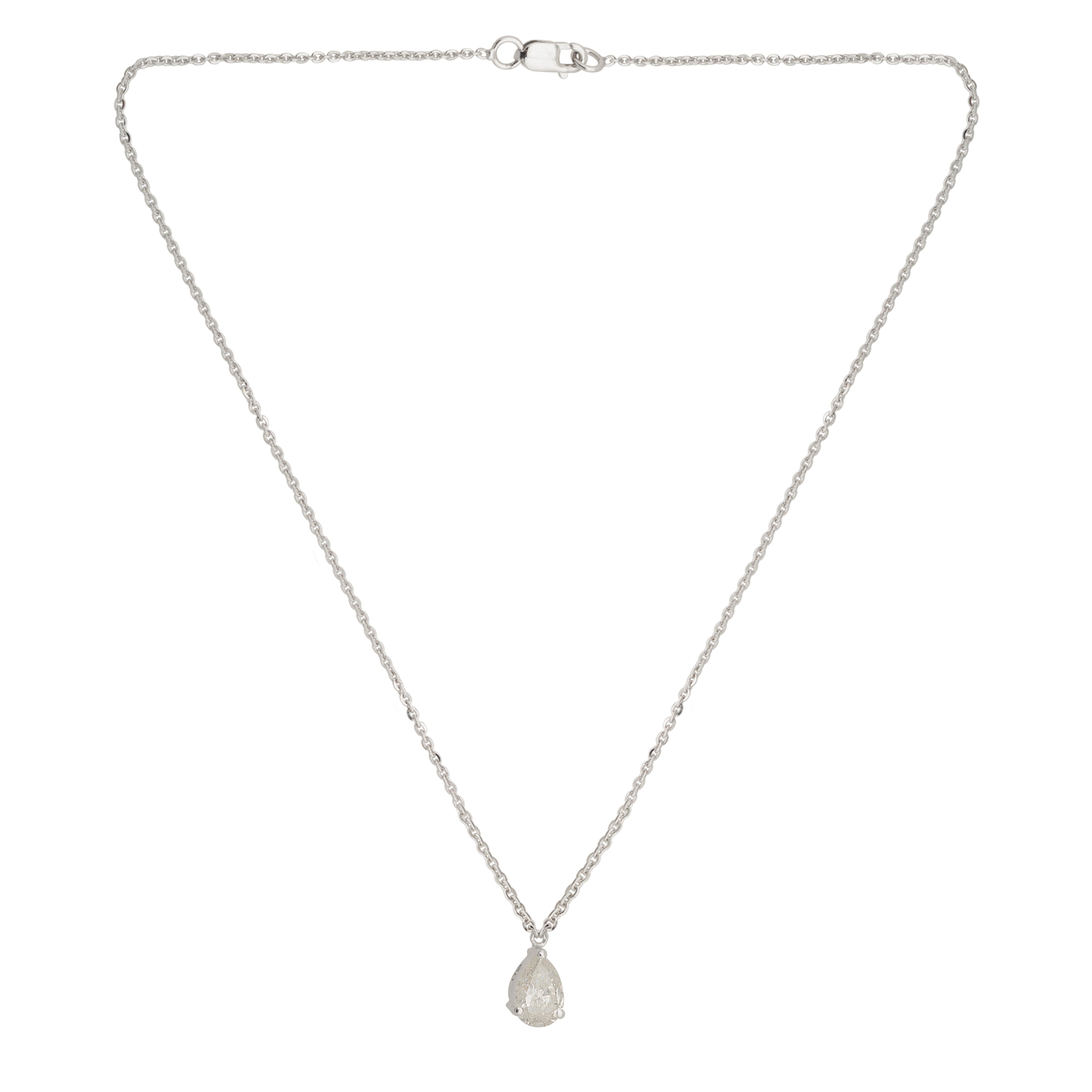This exquisite charm pendant necklace features a 0.57 carat diamond with SI clarity and HI color, set in a pear shape, and crafted in 14 karat white gold. Meticulously handcrafted with attention to detail, this piece of jewelry radiates elegance,