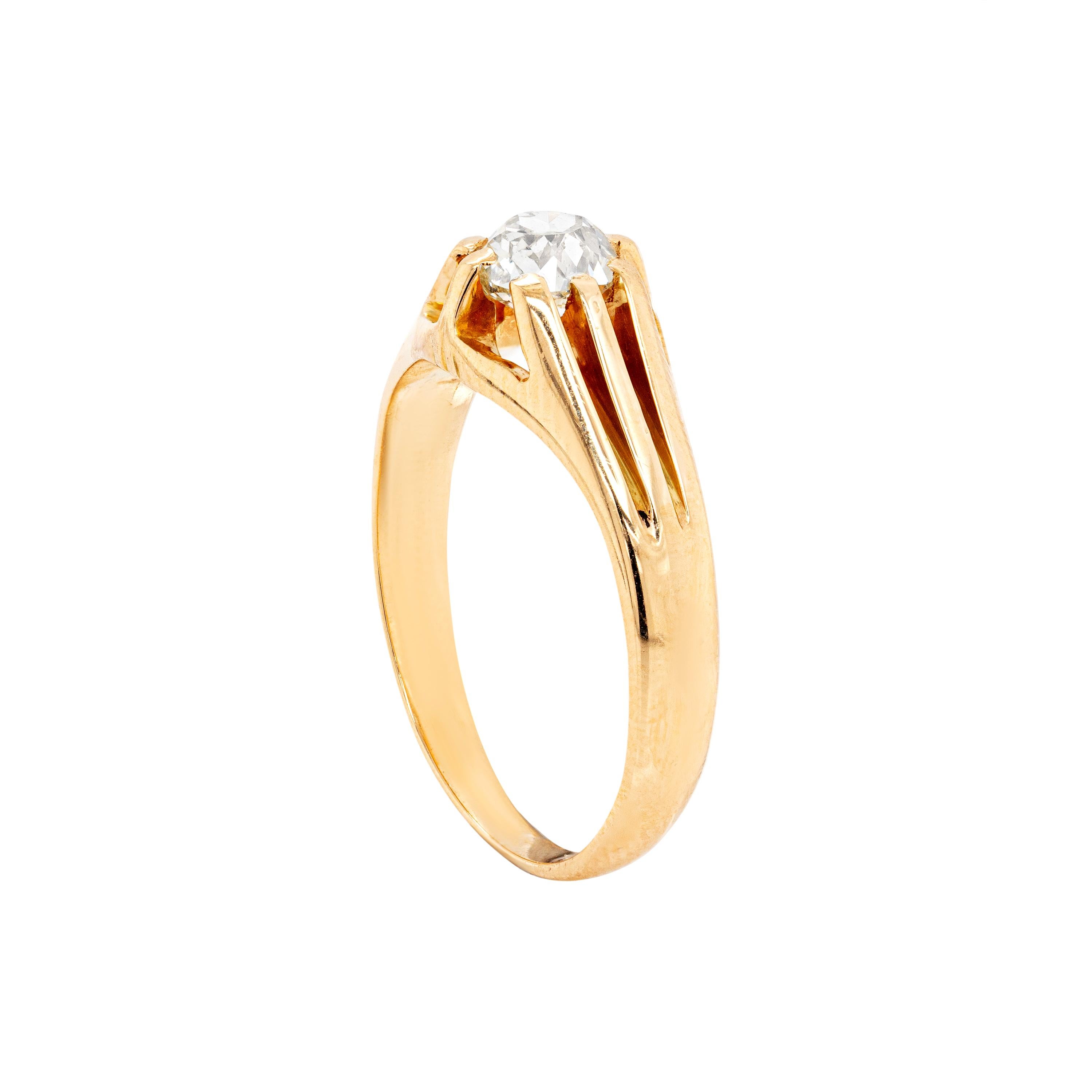 A classic 18 carat yellow gold antique ring centred with a beautiful old mine cut diamond weighing 0.57ct, mounted in a raised eight claw, open back setting. Tested 18 carat gold. UK finger size 'L'.