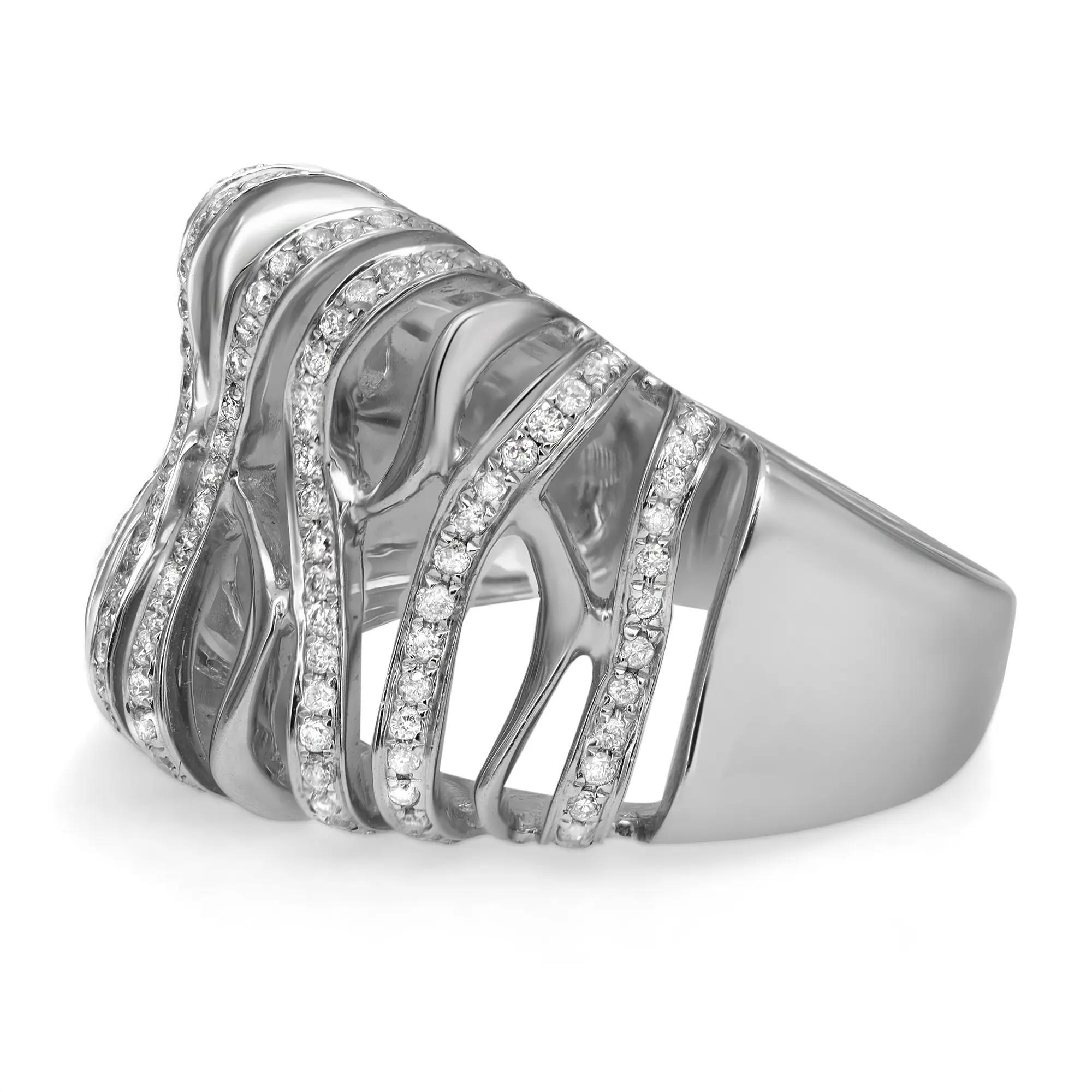 This beautiful diamond wide band ring showcases pave set round cut diamonds in a modern one of a kind design. Crafted in fine 14k white gold. Total diamond weight: 0.57 carat. Diamond quality: color I and SI1 clarity. Ring size 7.75. Band width: