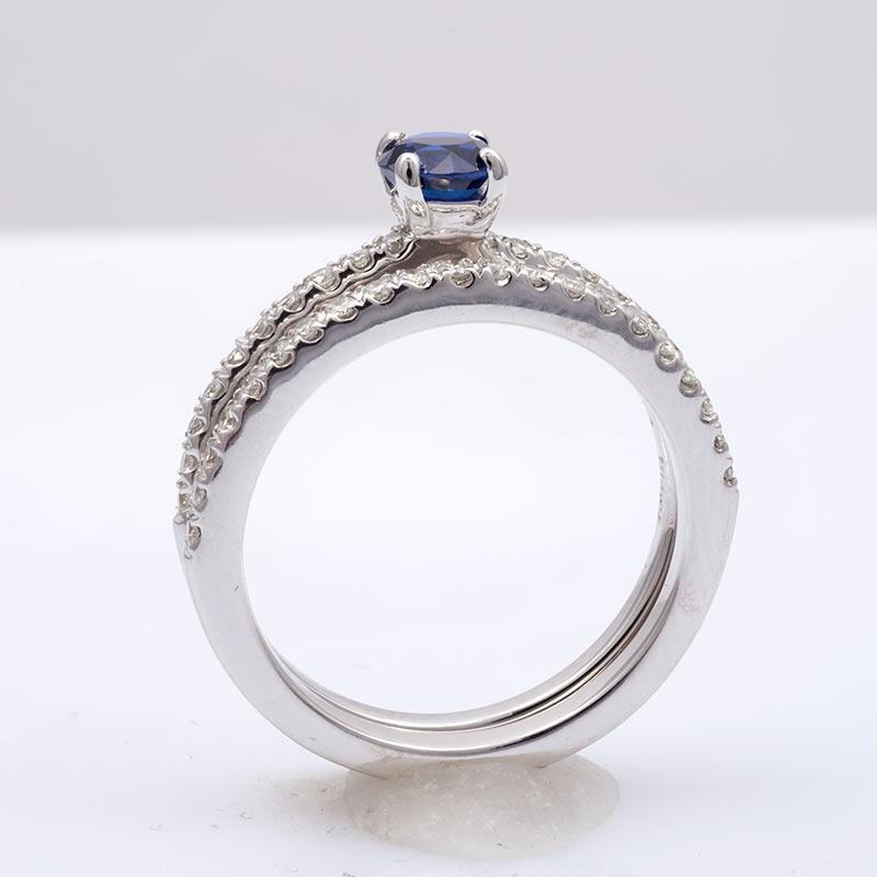 This is a single, enchanting blue Sapphire, boasting a total weight of 0.58 carats. The intensity of its blue hue is strong, radiating from its perfectly shaped round form. The gem is exceptionally clear to the eye, presenting a brilliant step cut