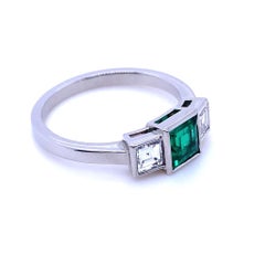 0.58 Carat Columbian Emerald and Diamond Three Stone Platinum Engagement Ring