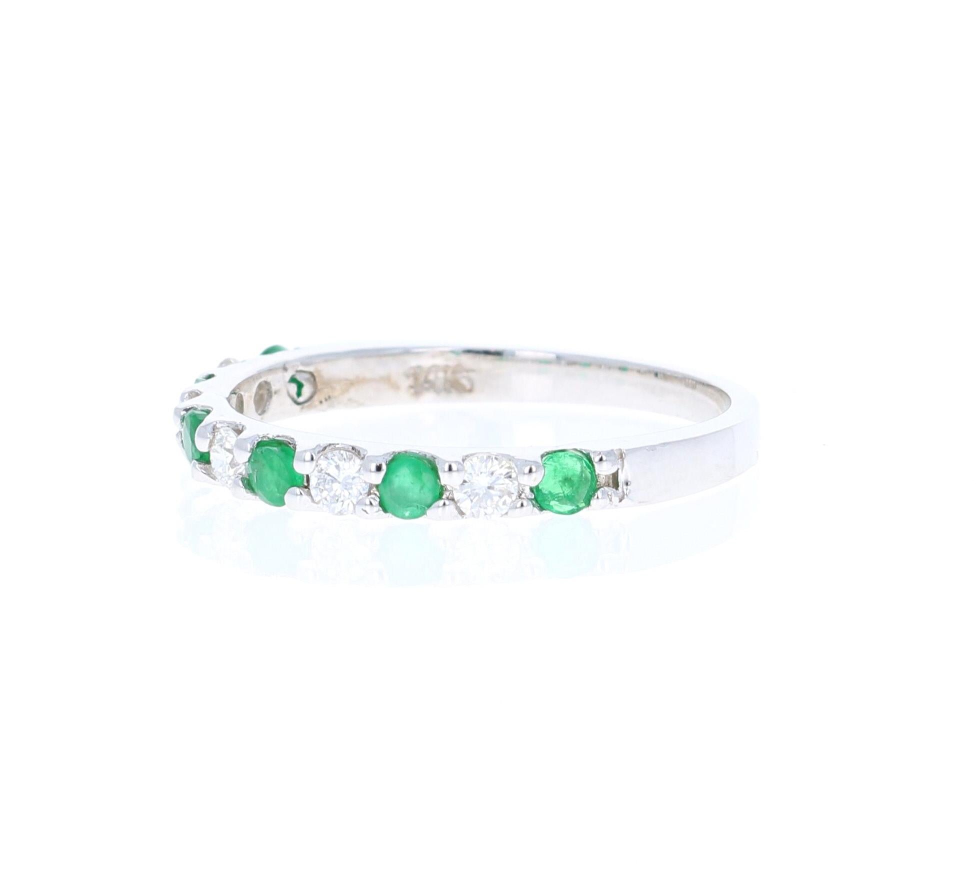 Contemporary 0.58 Carat Emerald and Diamond 14 Karat White Gold Band For Sale
