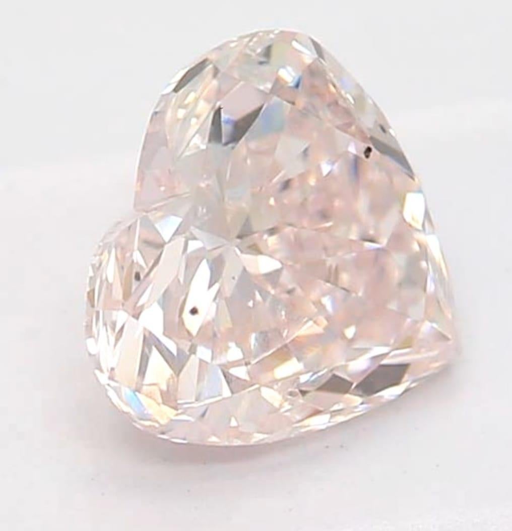 *100% NATURAL FANCY COLOUR DIAMOND*

✪ Diamond Details ✪

➛ Shape: Heart
➛ Colour Grade: Light Pink 
➛ Clarity: 0.58
➛ GIA Certified 

^FEATURES OF THE DIAMOND^

Our light pink diamond exhibits a delicate pink hue with varying degrees of saturation,