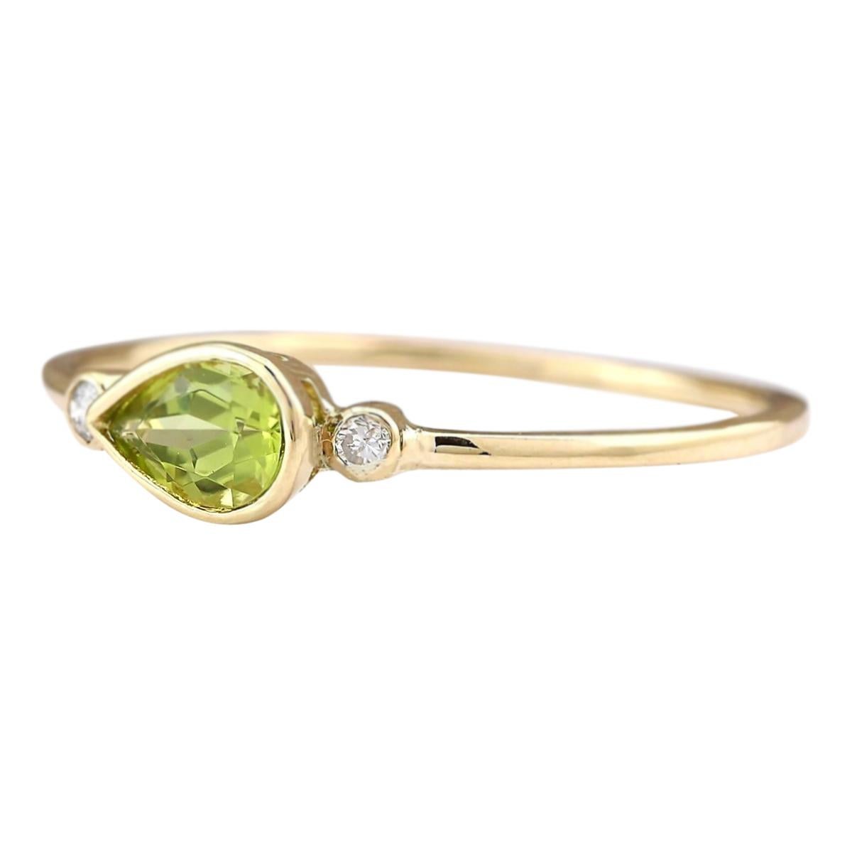 Stamped: 14K Yellow Gold
Total Ring Weight: 1.1 Grams
Total Natural Peridot Weight is 0.50 Carat (Measures: 7.00x5.00 mm)
Color: Green
Diamond Weight: Total Natural Diamond Weight is 0.08 Carat
Color: F-G, Clarity: VS2-SI1
Face Measures: 5.00x11.40