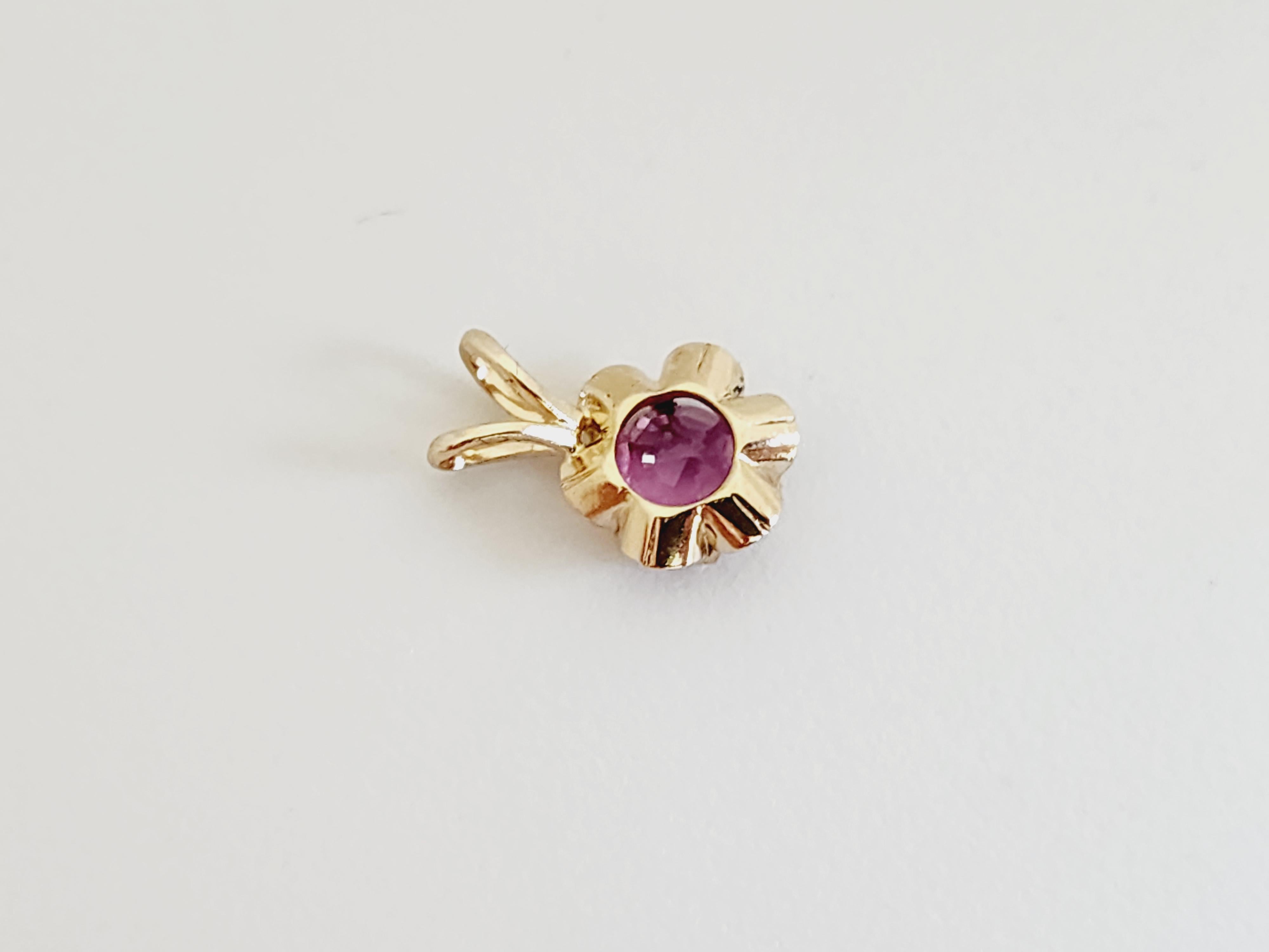 Add a touch of elegance to your jewelry collection with this stunning 0.58 carat pink sapphire pendant, crafted in radiant 14 karat yellow gold. The vibrant pink sapphire is beautifully set to showcase its brilliant color and sparkle.

Gemstone: