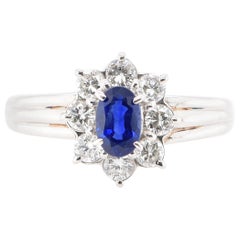0.58 Carat Sapphire and Diamond Halo Engagement Ring Set in Platinum