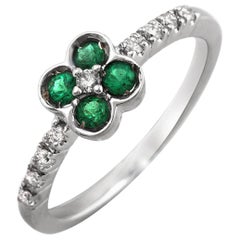 0.58 Ct Colombian Emerald 
0.18 Ct Diamonds In 18k Gold Flower Ring