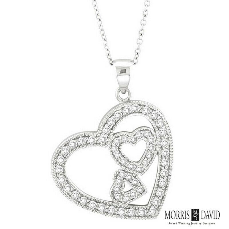 100% Natural Diamonds, Not Enhanced in any way Round Cut Diamond Necklace  
0.58CT
G-H 
SI  
3/4 inch in height, 3/4 inch in width
14K White Gold,    Prong style,   5 grams
57 Diamonds

N4815WD
ALL OUR ITEMS ARE AVAILABLE TO BE ORDERED IN 14K WHITE,